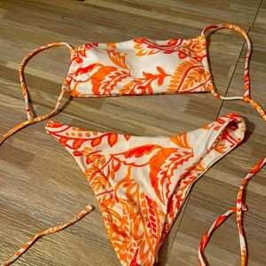 Women’s orange red and white bathing suit. Size medium